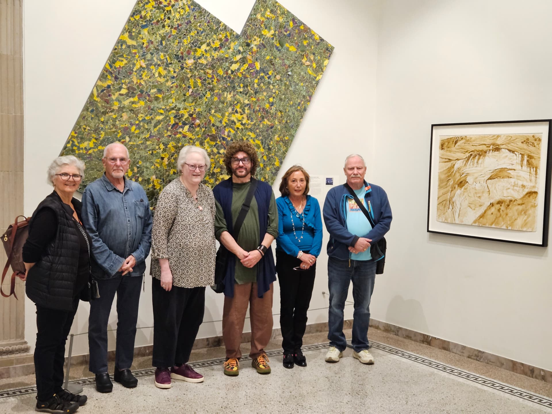 Six workshop participants standing together beside artworks at the Montclair Art Museum