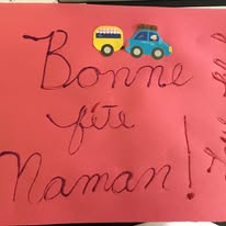 A handmade French Mother’s Day card reading Bonne fête Maman, decorated with vehicle stickers
